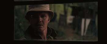 Movie still from “Deliverance” (1972), directed by John Boorman – A person wearing a hat; Close Up shot, Over the shoulder angle