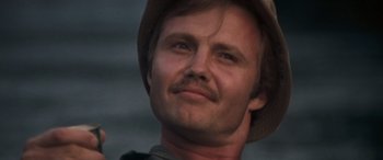 Movie still from “Deliverance” (1972), directed by John Boorman – A person wearing a hat; Close Up shot, Low angle