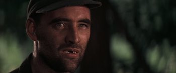 Movie still from “Deliverance” (1972), directed by John Boorman – A person wearing a hat; Close Up shot, Low angle