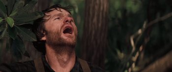 Movie still from “Deliverance” (1972), directed by John Boorman – A person with his mouth wide open; Close Up shot, Low angle