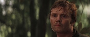 Movie still from “Deliverance” (1972), directed by John Boorman – A person with wet hair; Close Up shot, Low angle