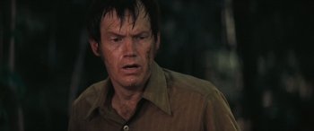 Movie still from “Deliverance” (1972), directed by John Boorman – A person wearing a brown shirt; Close Up shot, Over the shoulder angle