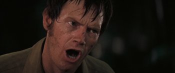 Movie still from “Deliverance” (1972), directed by John Boorman – A person with wet hair; Close Up shot, Low angle