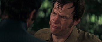 Movie still from “Deliverance” (1972), directed by John Boorman – A person with wet hair; Close Up shot, Over the shoulder angle