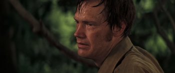 Movie still from “Deliverance” (1972), directed by John Boorman – A person with wet hair; Close Up shot, Over the shoulder angle