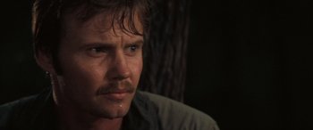 Movie still from “Deliverance” (1972), directed by John Boorman – A person wearing a shirt; Close Up shot, Over the shoulder angle