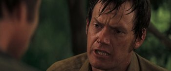 Movie still from “Deliverance” (1972), directed by John Boorman – A person with wet hair; Close Up shot, Over the shoulder angle