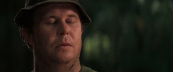 Movie still from “Deliverance” (1972), directed by John Boorman – A person with his eyes closed; Close Up shot, Low angle