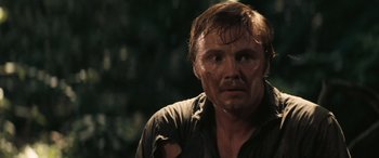 Movie still from “Deliverance” (1972), directed by John Boorman – A person wearing a shirt with mud on it; Close Up shot, Over the shoulder angle