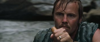 Movie still from “Deliverance” (1972), directed by John Boorman – A person holding a hot dog; Close Up shot, Low angle