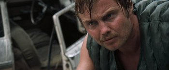 Movie still from “Deliverance” (1972), directed by John Boorman – A person with wet hair; Close Up shot, Over the shoulder angle