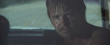 Movie still from “Deliverance” (1972), directed by John Boorman – A person with wet hair; Close Up shot, Low angle