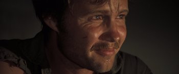 Movie still from “Deliverance” (1972), directed by John Boorman – A person with a mustache; Close Up shot, Over the shoulder angle