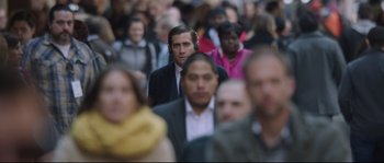 Movie still from “Demolition” (2015), directed by Jean-Marc Vallée – A crowd of people walking down a street; Medium shot, Over the shoulder angle