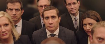 Movie still from “Demolition” (2015), directed by Jean-Marc Vallée – A man in a suit and tie standing in front of two other men; Close Up shot, Low angle