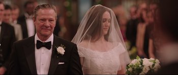 Movie still from “Demolition” (2015), directed by Jean-Marc Vallée – A woman in a wedding dress and a man in a suit; Close Up shot, Over the shoulder angle