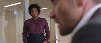 Movie still from “Demolition” (2015), directed by Jean-Marc Vallée – A woman standing in front of a man in front of a mirror; Medium shot, Over the shoulder angle
