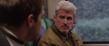 Movie still from “Demolition” (2015), directed by Jean-Marc Vallée – A person sitting on a chair; Close Up shot, Over the shoulder angle