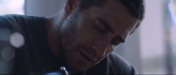 Movie still from “Demolition” (2015), directed by Jean-Marc Vallée – A person with a cell phone; Close Up shot, Low angle