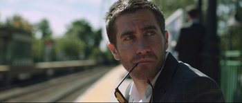 Movie still from “Demolition” (2015), directed by Jean-Marc Vallée – A person wearing a suit and sunglasses; Close Up shot, Over the shoulder angle