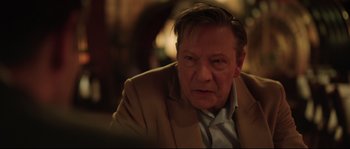 Movie still from “Demolition” (2015), directed by Jean-Marc Vallée – An older man wearing a suit and tie; Close Up shot, Over the shoulder angle