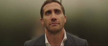 Movie still from “Demolition” (2015), directed by Jean-Marc Vallée – A person wearing a suit and tie; Close Up shot, Low angle