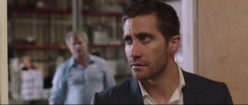 Movie still from “Demolition” (2015), directed by Jean-Marc Vallée – A person wearing a suit and tie; Close Up shot, Over the shoulder angle