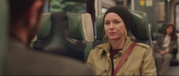 Movie still from “Demolition” (2015), directed by Jean-Marc Vallée – A woman sitting on a bus looking at the camera; Close Up shot, Over the shoulder angle