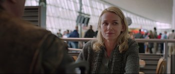 Movie still from “Demolition” (2015), directed by Jean-Marc Vallée – A woman sitting at a table in front of other people; Close Up shot, Over the shoulder angle