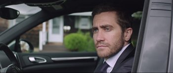 Movie still from “Demolition” (2015), directed by Jean-Marc Vallée – A person wearing a suit and tie; Close Up shot, Over the shoulder angle