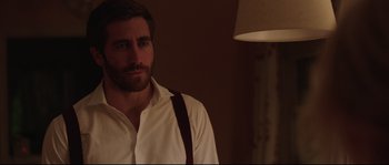 Movie still from “Demolition” (2015), directed by Jean-Marc Vallée – A person wearing suspenders near a lamp; Close Up shot, Over the shoulder angle