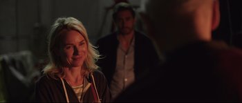 Movie still from “Demolition” (2015), directed by Jean-Marc Vallée – A woman standing next to a man in a dark room; Close Up shot, Over the shoulder angle