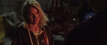 Movie still from “Demolition” (2015), directed by Jean-Marc Vallée – A woman with blonde hair standing in a dark room; Close Up shot, Over the shoulder angle