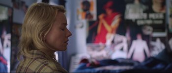 Movie still from “Demolition” (2015), directed by Jean-Marc Vallée – A woman with her eyes closed in front of a painting; Close Up shot, Over the shoulder angle