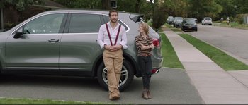 Movie still from “Demolition” (2015), directed by Jean-Marc Vallée – A man and a woman standing in front of a parked car; Wide shot, Over the shoulder angle