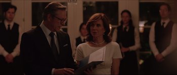 Movie still from “Demolition” (2015), directed by Jean-Marc Vallée – A man and a woman standing next to each other holding papers; Close Up shot, Over the shoulder angle