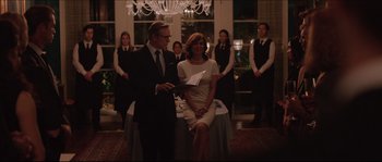 Movie still from “Demolition” (2015), directed by Jean-Marc Vallée – A man and a woman standing next to each other in front of a table; Medium shot, Over the shoulder angle