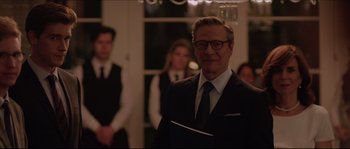 Movie still from “Demolition” (2015), directed by Jean-Marc Vallée – A man in a suit and tie holding a book; Medium shot, Over the shoulder angle