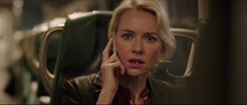 Movie still from “Demolition” (2015), directed by Jean-Marc Vallée – A woman talking on a cell phone while sitting on a chair; Close Up shot, Over the shoulder angle