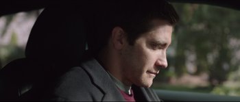 Movie still from “Demolition” (2015), directed by Jean-Marc Vallée – A person wearing a suit; Close Up shot, Over the shoulder angle