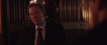 Movie still from “Demolition” (2015), directed by Jean-Marc Vallée – A man in a suit and tie standing in front of a wooden wall; Close Up shot, Over the shoulder angle