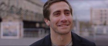 Movie still from “Demolition” (2015), directed by Jean-Marc Vallée – A person smiling for the camera; Close Up shot, Over the shoulder angle