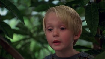 Movie still from “Dennis the Menace” (1993), directed by Nick Castle – A young boy with blonde hair; Close Up shot, Low angle