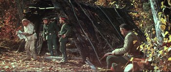 Movie still from “Dersu Uzala” (1975), directed by Akira Kurosawa – A group of men standing next to each other on a field; Wide shot, High angle