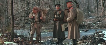 Movie still from “Dersu Uzala” (1975), directed by Akira Kurosawa – A group of men standing next to each other on a field; Wide shot, High angle