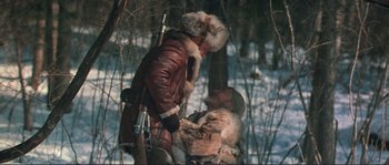 Movie still from “Dersu Uzala” (1975), directed by Akira Kurosawa – A man in a brown leather jacket and a woman in a white fur coat; Medium shot, Over the shoulder angle