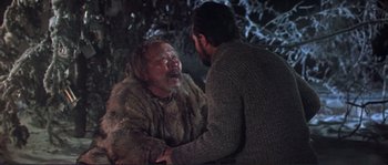 Movie still from “Dersu Uzala” (1975), directed by Akira Kurosawa – A man in a fur coat and a man with a beard are talking to each other; Medium shot, Over the shoulder angle