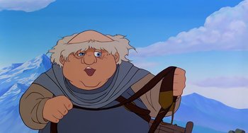 Movie still from “The Last Unicorn” (1982), directed by Jules Bass – An old man with a white beard is holding a steering wheel; Close Up shot, Low angle