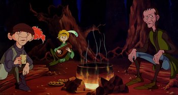 Movie still from “The Last Unicorn” (1982), directed by Jules Bass – A group of people sitting in front of a pot of food; Wide shot, High angle