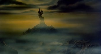Movie still from “The Last Unicorn” (1982), directed by Jules Bass – A painting of a hand on top of a mountain; Extreme Wide shot, Low angle